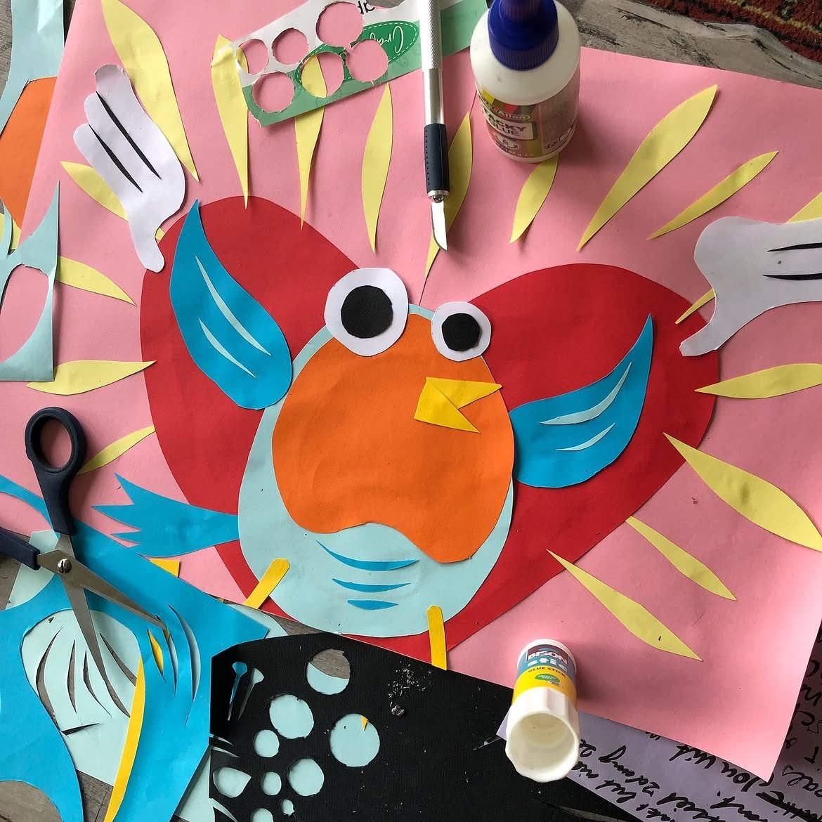 Robin het Roodborstje as a full-colour paper collage, scissors and glue on the table, by Robin Gnarly